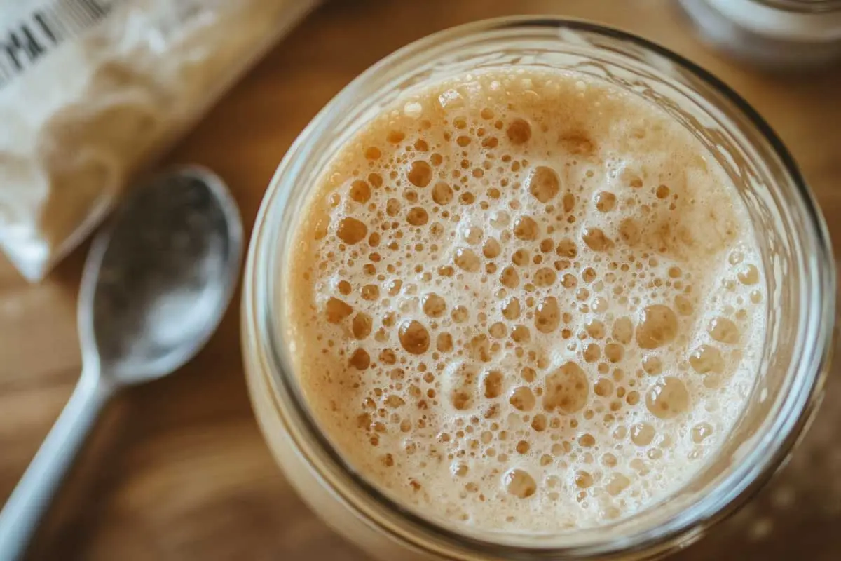 Active-Sourdough-Discard A bubbly, active sourdough discard in a glass jar, showing fermentation bubbles.