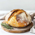 sourdough-recipes-boule-sliced Golden sourdough boule with airy crumb, sliced and ready to serve.