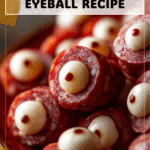 Halloween Party Hit: Salami Mozzarella Eyeballs Recipe 4 Festive Halloween plate filled with salami mozzarella eyeball appetizers 2