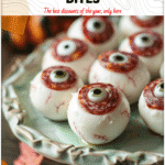 Mozzarella Eyeball Bites Wrapped in Salami 4 Mozzarella eyeball bites wrapped in salami slices served on a Halloween party spread 2