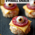 Quick Halloween Eyeballs Snack with Salami & Cheese 4 Quick Halloween mozzarella eyeballs with salami slices served as spooky appetizers 2