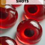 Red Jello Shot Recipe Halloween Eyeball Style 4 Red Jello Eyeball Shots served in clear glasses with festive Halloween props. 2